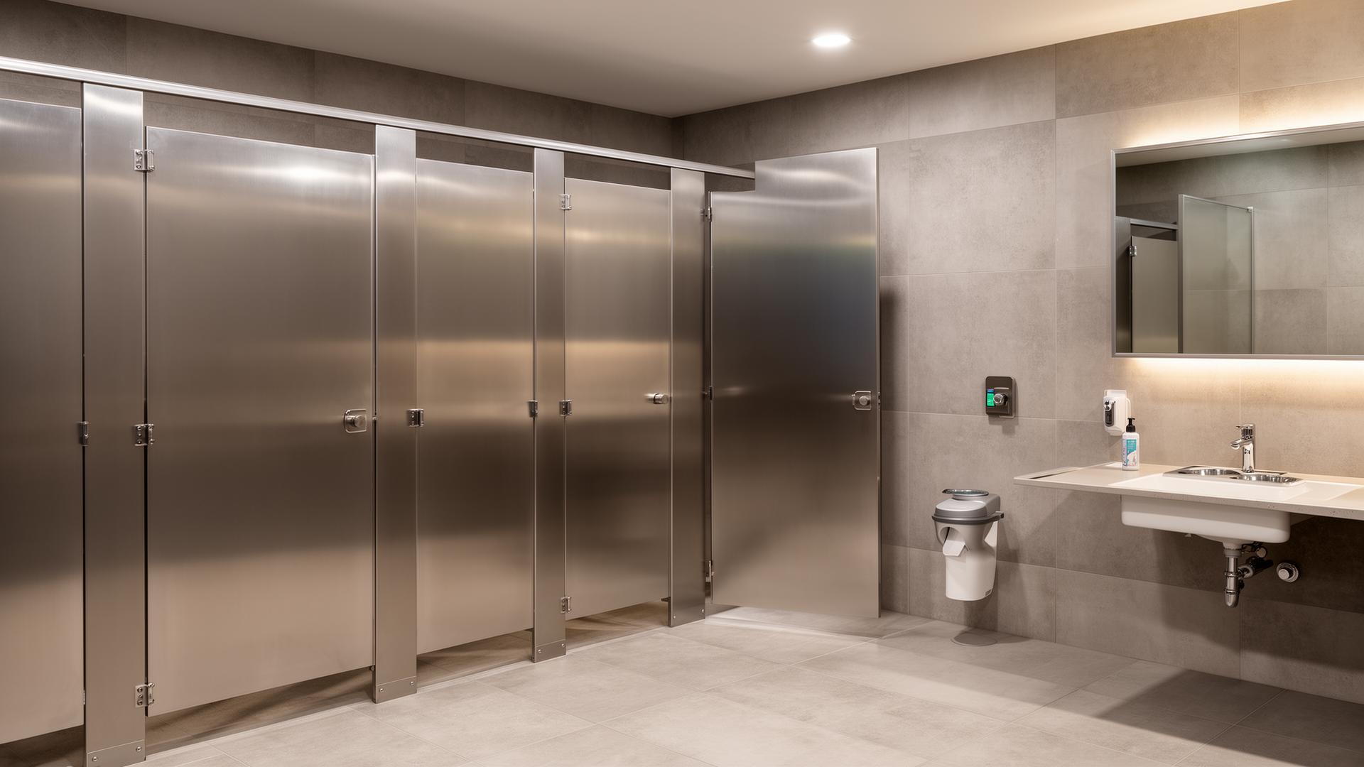 Commercial bathroom partitions in a modern restroom